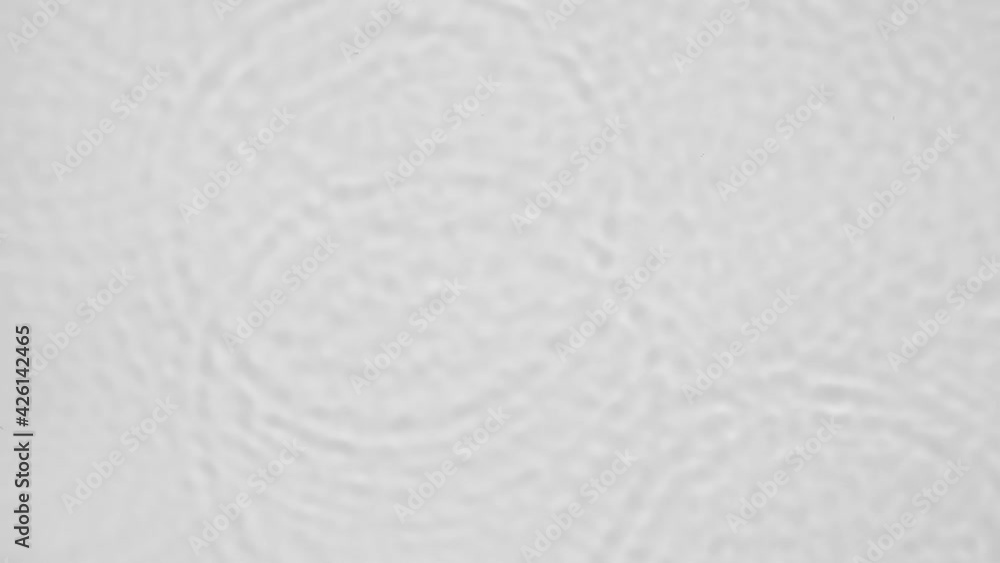 Poster up close, top view, slow motion various waves of the water surface hitting the sun's rays, making th