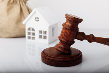 Real estate sale auction concept. Gavel and house model
