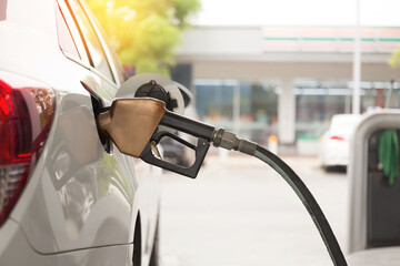 Pumping gasoline fuel in car at gas station.concept Travel and transportation.