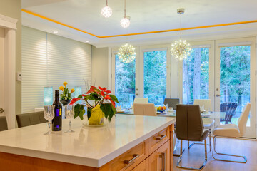 Modern, bright, clean, kitchen interior with stainless steel appliances in a luxury house
