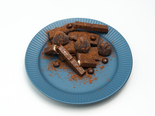 Composition of bars and pieces of different milk and dark chocolate, cocoa grater on a white background, top view