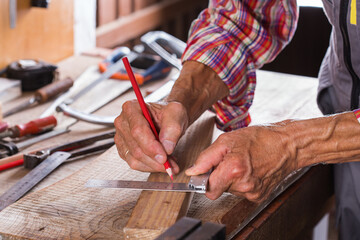 Carpenter working on the work bench, joinery tools and woodwork