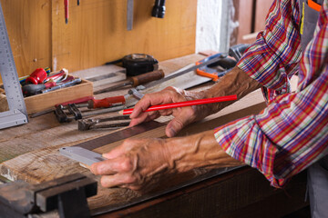 Carpenter working on the work bench, joinery tools and woodwork