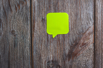 note on wooden background