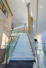 Painted in grey. Abstract fragment of the architecture of modern lobby, hallway of the luxury hotel, shopping mall, business center in Vancouver, Canada. Interior design.