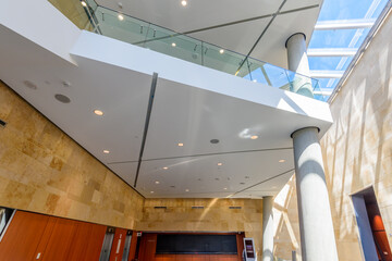 Painted in grey. Abstract fragment of the architecture of modern lobby, hallway of the luxury hotel, shopping mall, business center in Vancouver, Canada. Interior design.