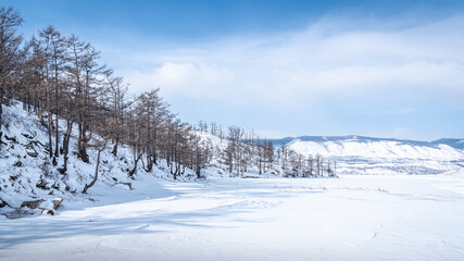 Fototapeta na wymiar Wooded peninsula on Lake Baikal