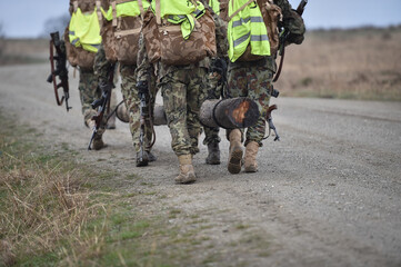 Special forces military training. Photograph detail with military equipment and assault rifle.