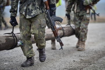 Special forces military training. Photograph detail with military equipment and assault rifle.