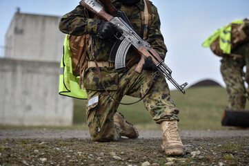 Special forces military training. Photograph detail with military equipment and assault rifle.