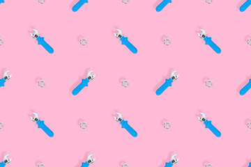 Wrench with nut seamless pattern. Background on the theme of repair or construction. 