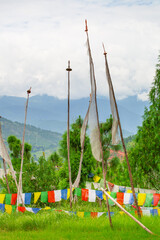 Fototapeta na wymiar Buddhist prayer flags in the field, Bhutan