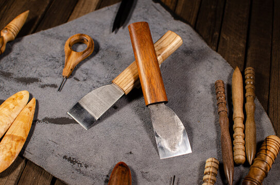 The tool for carving, leather polishing lies on the table
