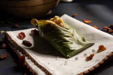 Quimbolito, a typical dish of Ecuadorian cuisine, is a steamed cake wrapped in an achira leaf.