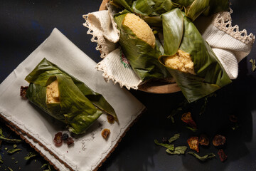 Dark food, Quimbolito, a typical dish of Ecuadorian cuisine, is a steamed cake wrapped in an achira leaf.