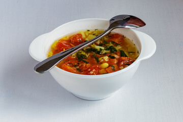Tomato soup with beans and spices. Delicious vegetarian soup.