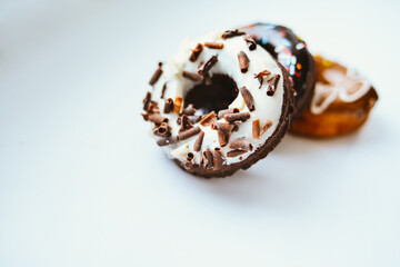 Delicious colorful donuts with different flavors on the background