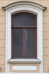 Windows on old city facades, with decorative elements