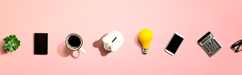 Office supplies with a piggy bank and a lightbulb
