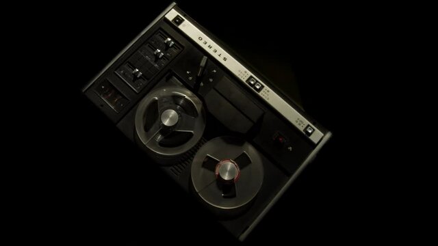 Reel to reel audio tape recorder plays recordings from police interrogation