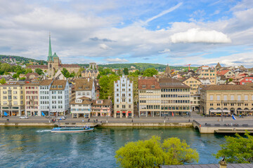 Naklejka na ściany i meble Beautiful view of historic city center of Zurich with river Limmat on a sunny day with blue sky and clouds in summer, Canton of Zurich, Switzerland.
