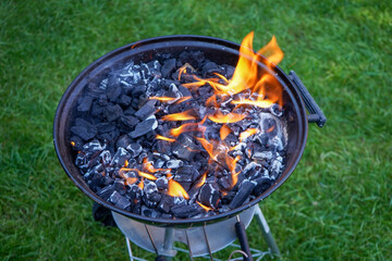 Flames on a charcoal BBQ © Robert