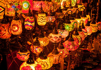 Many illuminated decorative lamps displayed in the souvenir shop in the Grand bazaar, Turkey.