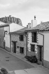 Ares del Maestrat (Maestre), Castellon province, Valencian Community, Spain. Beautiful traditional historic medieval village on top of a hill. Black and white photography of a street. 