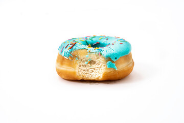 donut with one bite, blue frosting and colored sprinkles on a light background