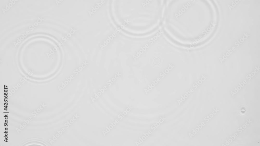 Poster up close, top view, slow motion various waves of the water surface hitting the sun's rays, making th