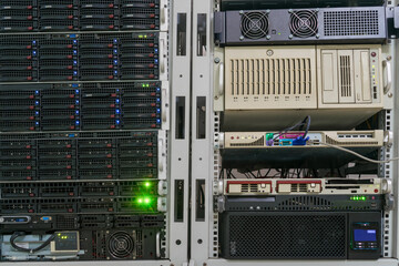 There are many different servers in a modern data center. Hosting platform of the Internet provider. There are racks with powerful computer equipment in the server room.