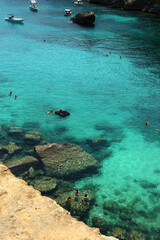 Santa Cesarea Terme, Puglia, Italy - july 14, 2017: Bay of Porto Miggiano. The amazing view of the deep blue and cerulean sea and mediterranean beach. Rocky landscape. Salento Adriatic sea coast