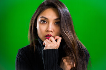 Portrait of a young Asian woman in close-up - studio photography