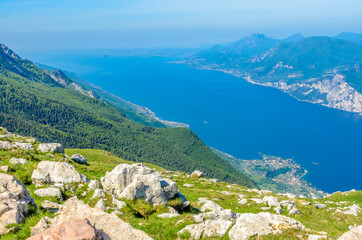 Fototapeta na wymiar Fragment of a nice mountain view Garda Lake from the trail at Monte Baldo in Italy.