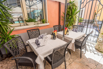 Outdoor restaurant tables in Lazise, Italy.