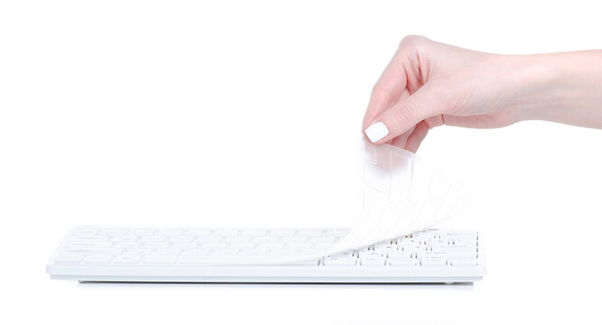White keyboard with silicone pad in hand on white background isolation