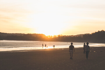 walking on the beach at sunrise