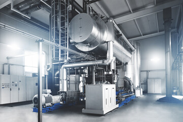 Rankine organic cycle turbine (ORC-turbine) installed in modern industrial boiler room with control...
