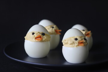 Devilled egg chicks prepared as Easter Eggs. Traditional celebration of making eggs as the symbol...