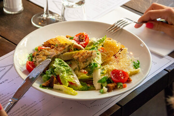 chicken and salad in a restaurant. 
