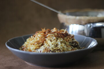 Mutton Biryani served from the pot after breaking the sealed edges. The edges were seled for slow cooking the rice.