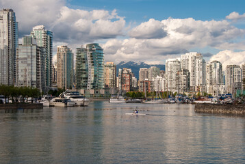 Fototapeta na wymiar A view of sunny Yaletown from False Creek Sea walk. Downtown of Vancouver. Canada.