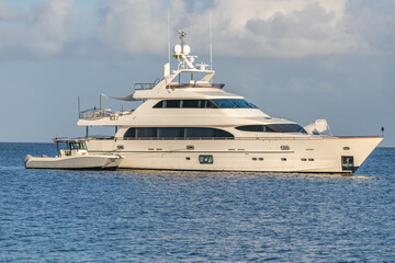 Fototapeta na wymiar Mega Yachts anchored in Mustique, Saint Vincent and the Grenadines