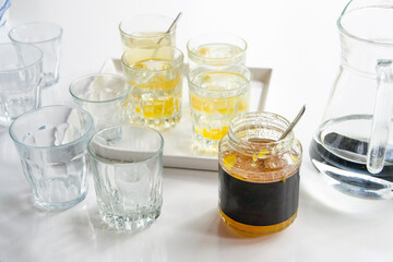 glasses for refreshing summer lemon, yuzu juice. White background