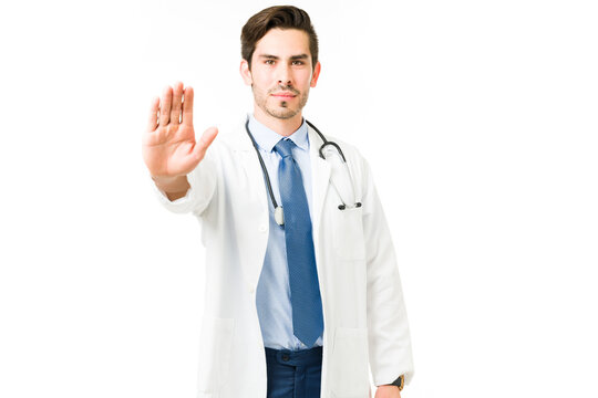 Professional Doctor Holding Up His Hand And Stopping