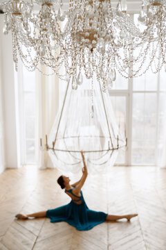 crystal chandelier against the background of the elegant dancer