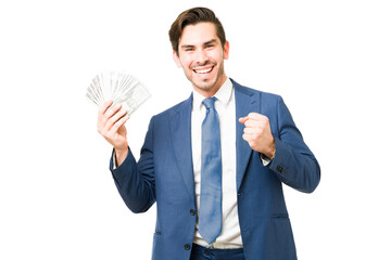 Portrait of a professional man celebrating with cash