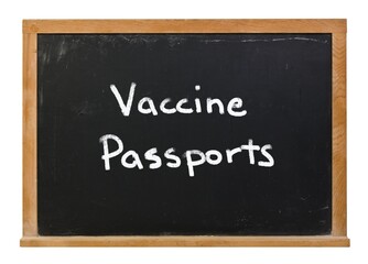 Vaccine Passports written in white chalk on a black chalkboard isolated on white