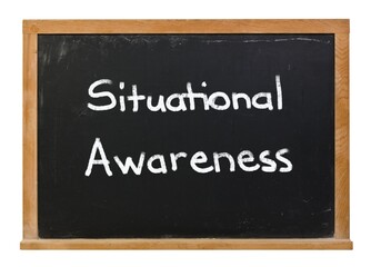 Situational Awareness written in white chalk on a black chalkboard isolated on white