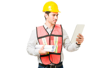 Focused professional architect looking at construction plans